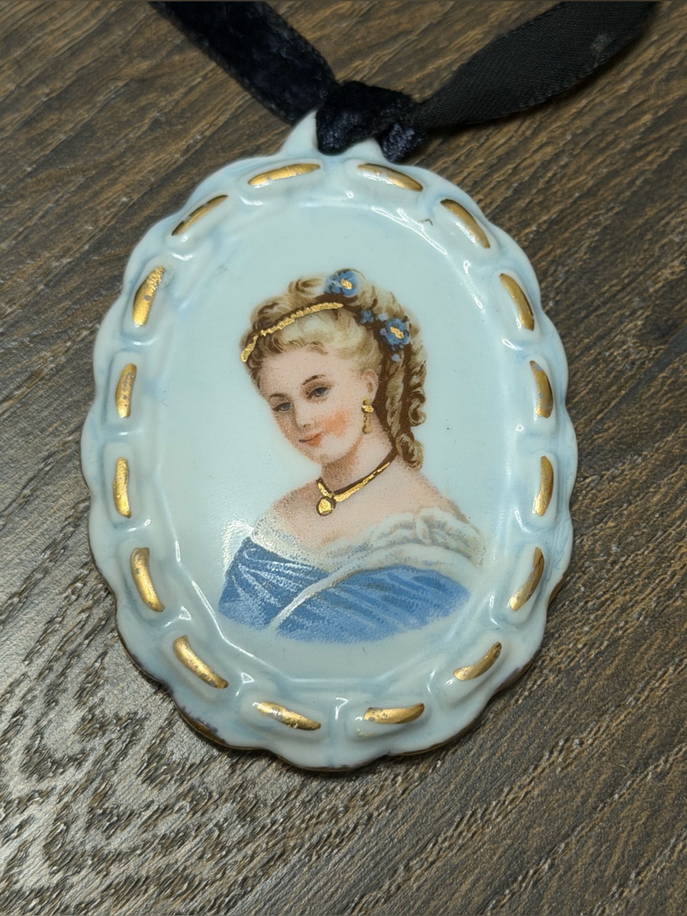 Vintage Limoges porcelain hand-painted portrait on a velvet tie.